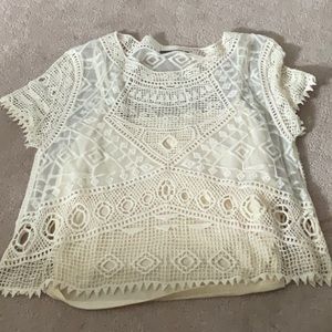 Black tape cropped lace top with built in camisole. Size ex-large.